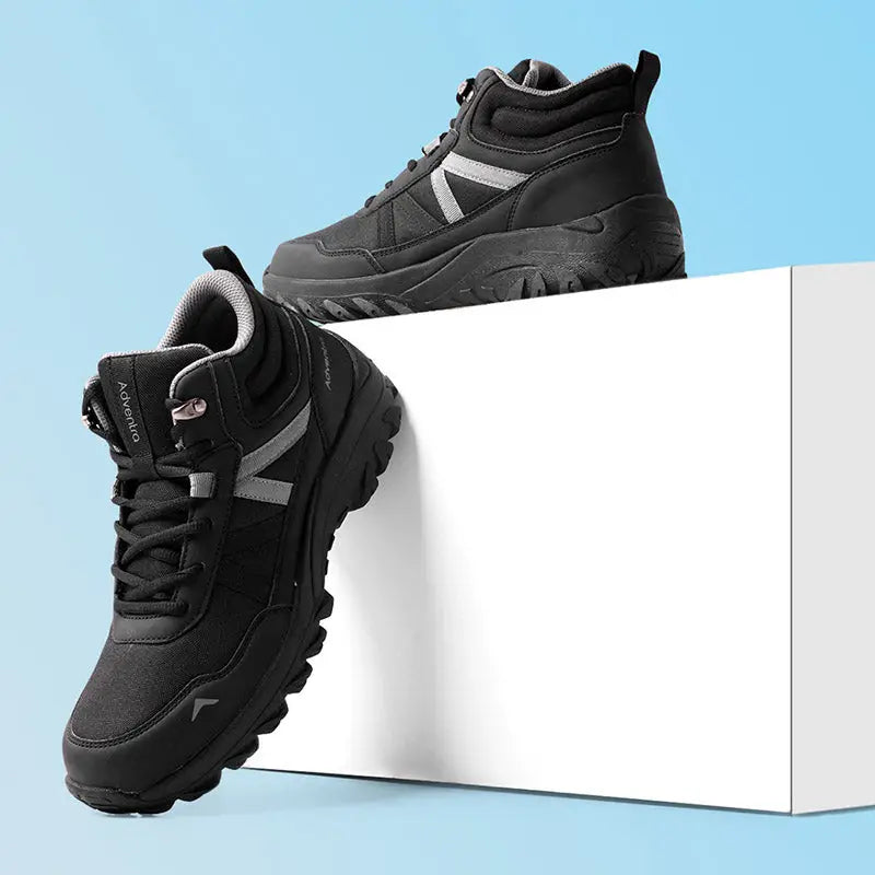 Black Adventra men's mid ankle hiking shoes with breathable mesh and rugged soles, designed for outdoor adventures.