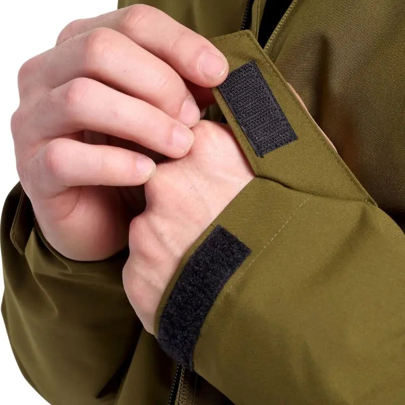 Green Adventra men's waterproof winter hiking jacket designed for cold weather, featuring a durable, insulated outdoor jacket for winter hikes.