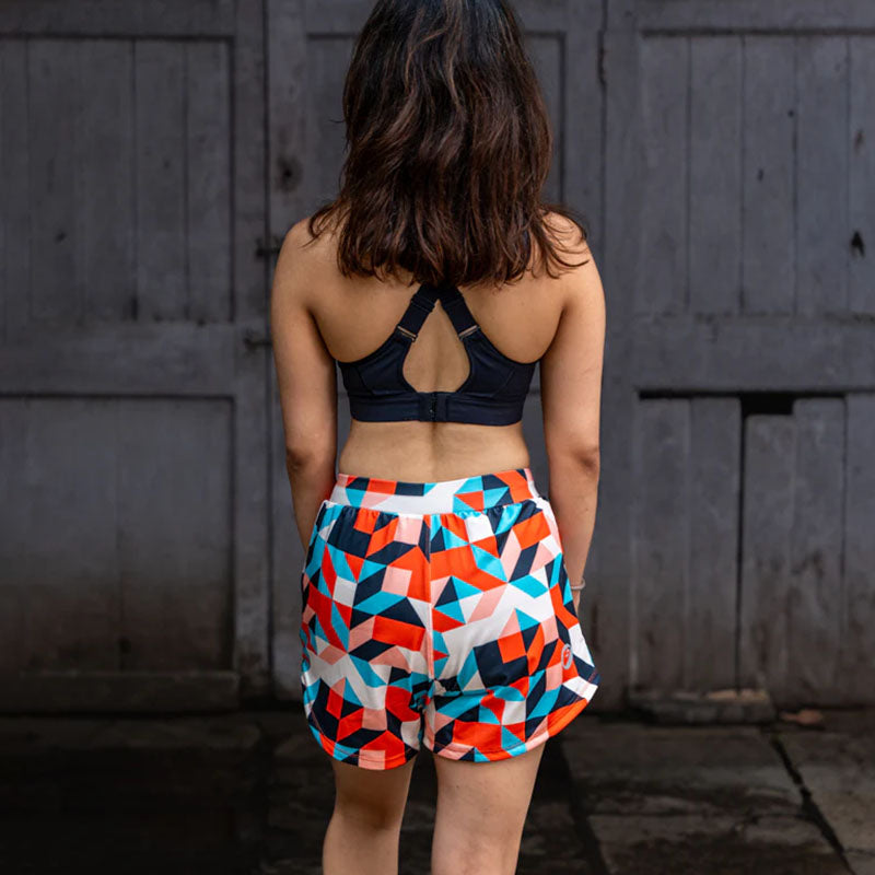 Apace women's 3-inch running shorts in vibrant art deco pattern, lightweight and designed for active wear.