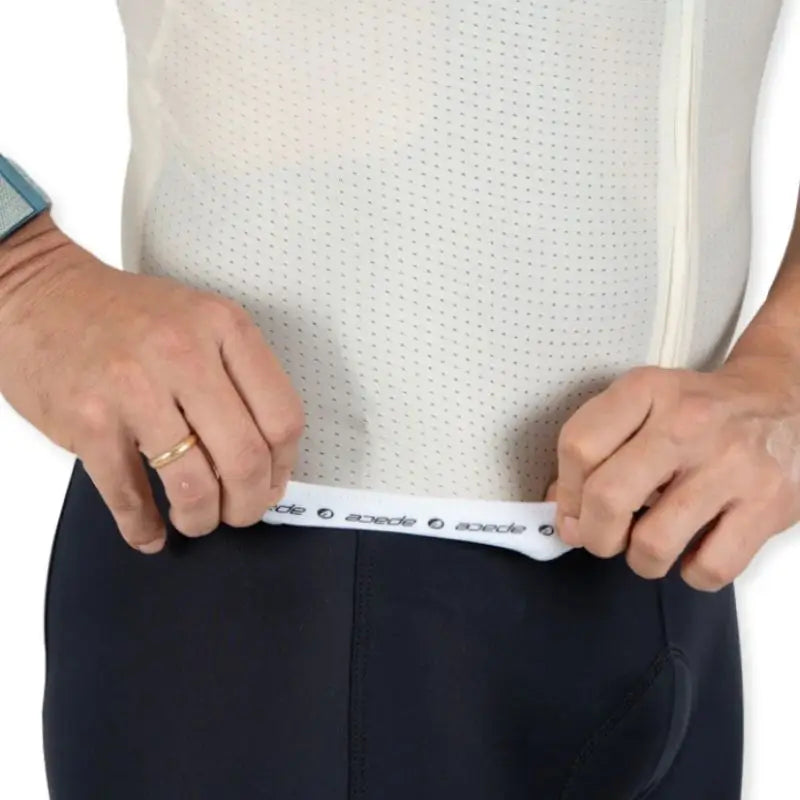Apace Women's Elite Fit Cycling Jersey in mint green, featuring a close-up of the breathable fabric and sleek design.
