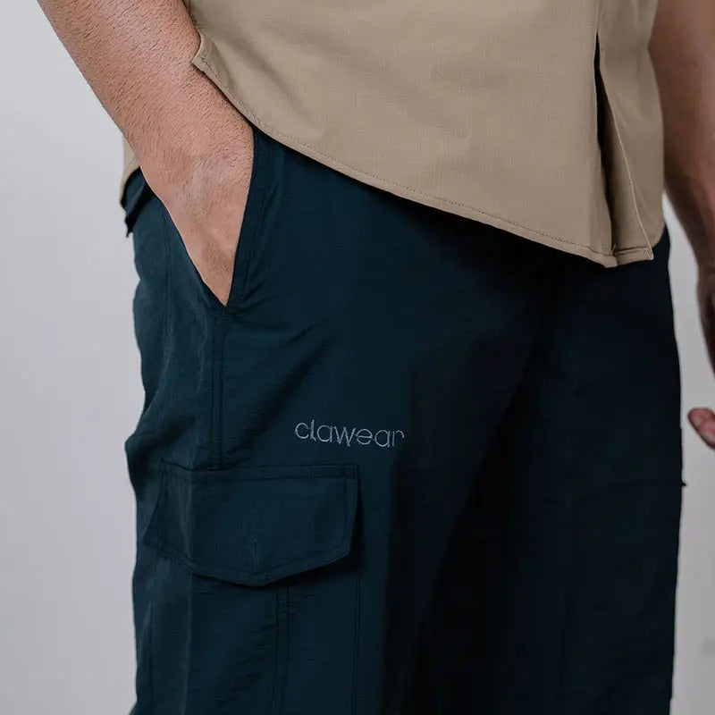 Clawear men's Masai cargo pants in green with multiple pockets and relaxed fit, showcasing durable fabric and casual style.