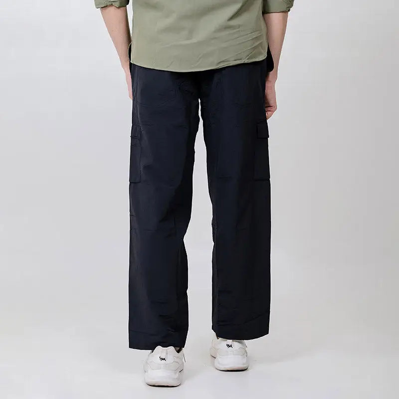 Black Clawear men's Masai cargo pants with multiple pockets and relaxed fit, made from durable fabric.