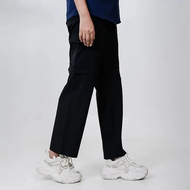 Black Clawear Women's Kuno convertible cargo pants with multiple pockets and adjustable features, shown on a model.