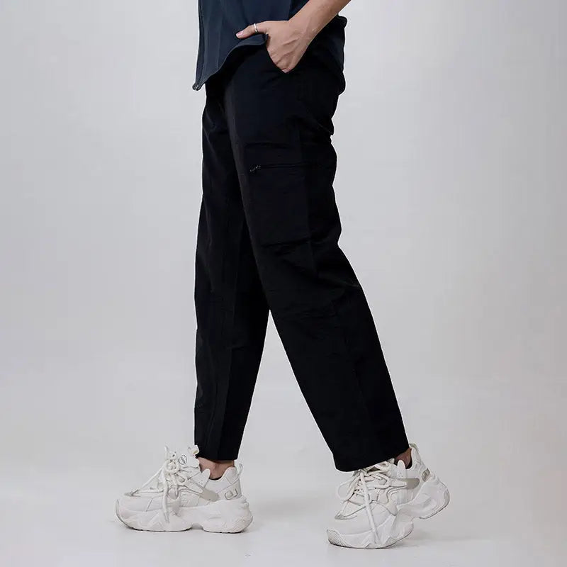 Clawear Women's Masai Cargo Pants in black, featuring multiple pockets and a relaxed fit, suitable for casual wear.