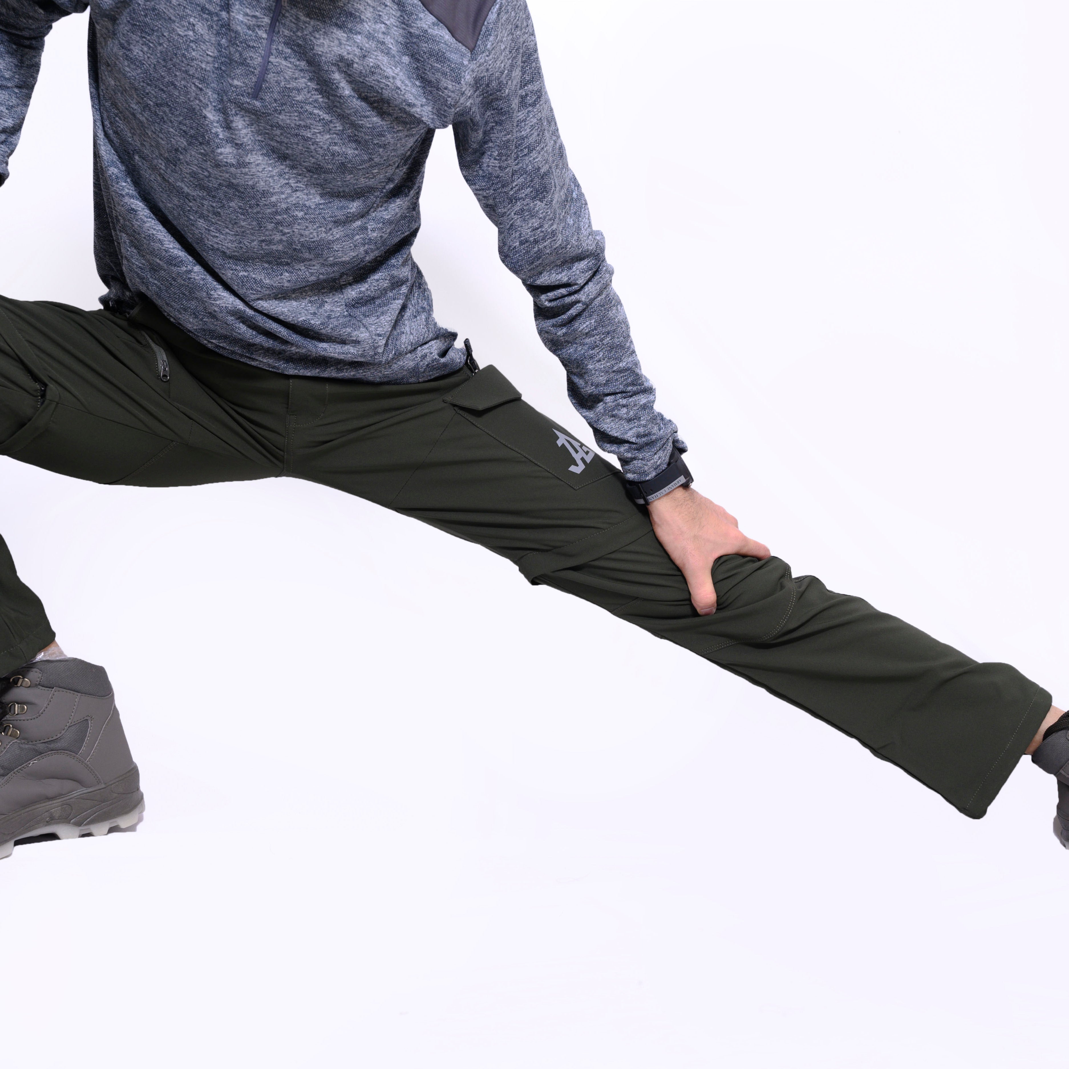 JAG Men's Discovery Series convertible cargo pants with zip-off legs, multiple pockets, and durable fabric for hiking and travel adventures.