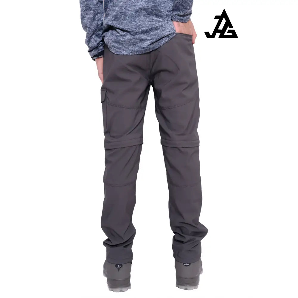 JAG men's Discovery Series convertible trekking and hiking pants in gray, showing multiple pockets and adjustable features.