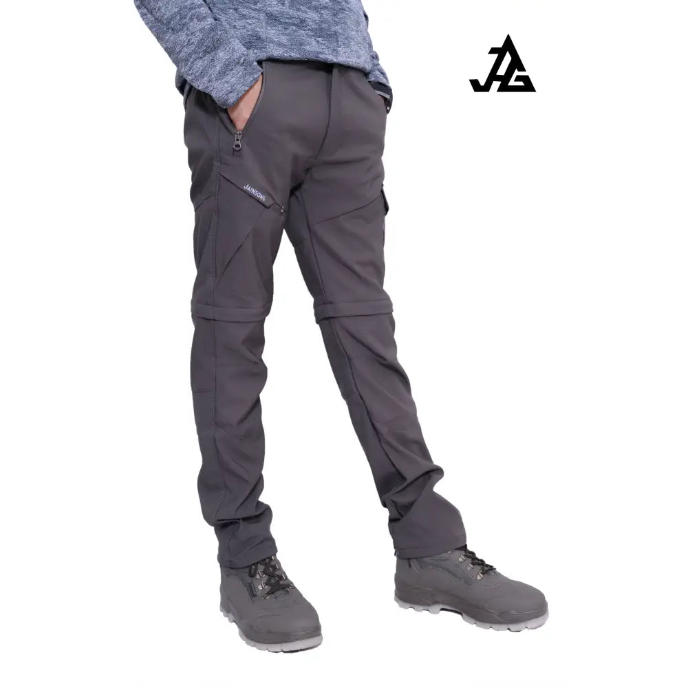 Gray JAG Men's Discovery Series convertible cargo pants with multiple pockets and adjustable waistband for hiking and travel.