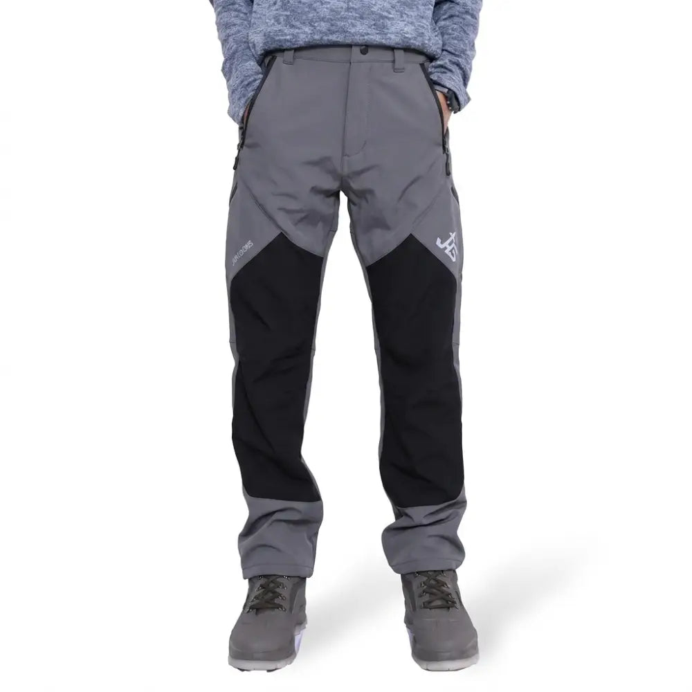Men's snow-proof trekking pants by JAG from the Mt. Kailash series, featuring multiple pockets in gray and black cargo style.