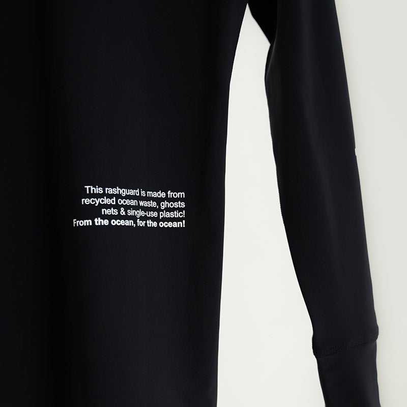 Surface Interval Women's Oceanic human rash guard full sleeve T-shirt in black, designed for water activities and sun protection.