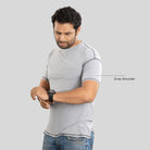 Gray Ruggd Indian men's odor-resistant bamboo training T-shirt displayed on a hanger, showcasing its comfortable fit and fabric texture.