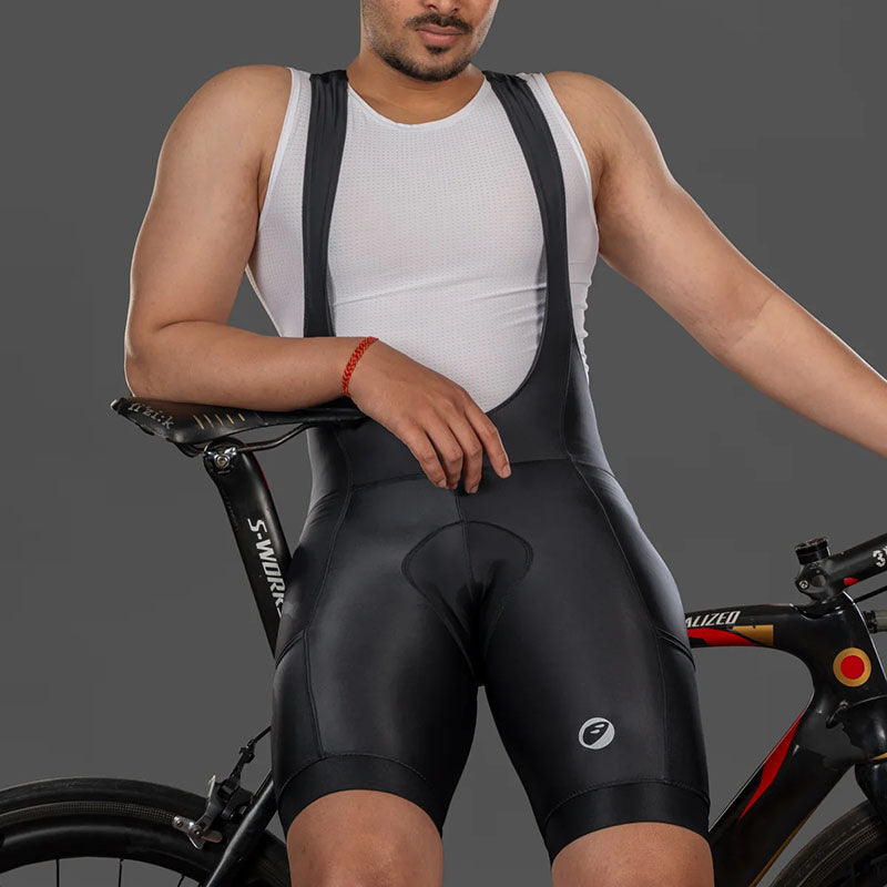 Apace men's cycling bib shorts Explore with padded chamois, black fabric, and adjustable straps for comfortable bike riding.