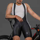 Apace men's cycling bib shorts Explore with padded chamois, black fabric, and adjustable straps for comfortable bike riding.