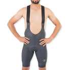 Apace men's cycling endurance bib shorts in slate gray, featuring padded shorts with adjustable straps and cycling-specific design.