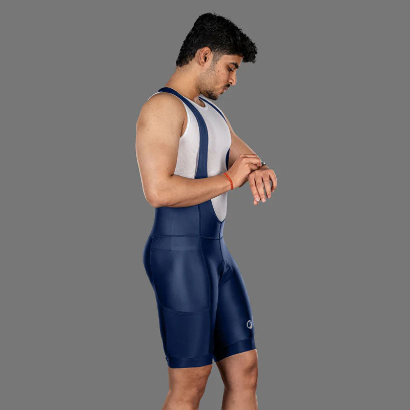 Apace men's Explore cycling bib shorts in navy, featuring padded design and moisture-wicking fabric for comfortable riding.