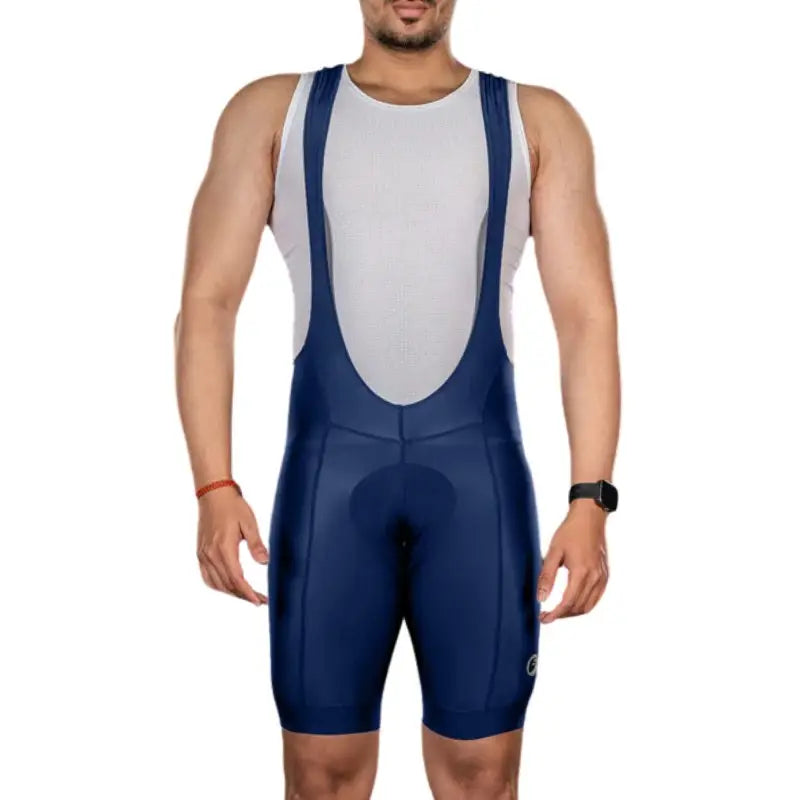 Apace men's Explore cycling bib shorts in navy, featuring padded chamois, breathable fabric, and adjustable straps for comfort.