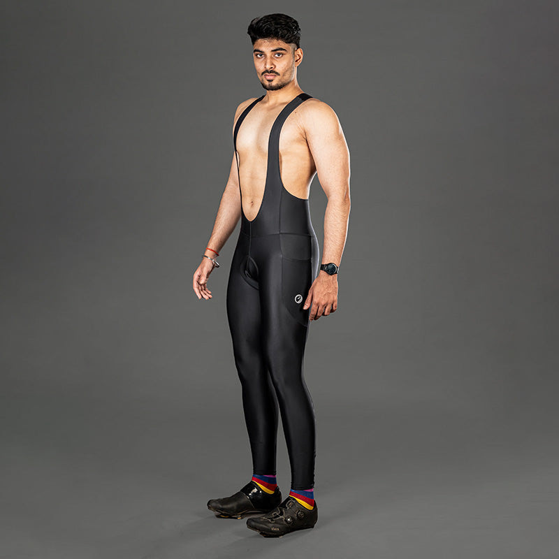 Apace men's gel padded cycling bib full tights shorts, close-up view showing black fabric and padded seat for comfort.