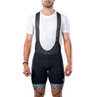 Apace men's premium cycling bib shorts, close-up view showing black breathable fabric and padded chamois for comfort.