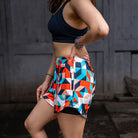 Apace women's 3-inch running shorts in lightweight fabric, featuring an art deco pattern on the side.