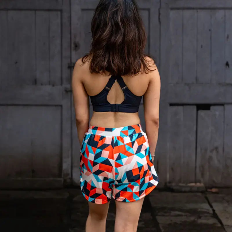 Apace women's 3-inch running shorts in vibrant art deco pattern, lightweight and designed for active wear.
