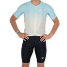 Apace Women's Elite Fit Cycling Jersey in mint green with black accents, featuring a close-up of the breathable fabric and logo.