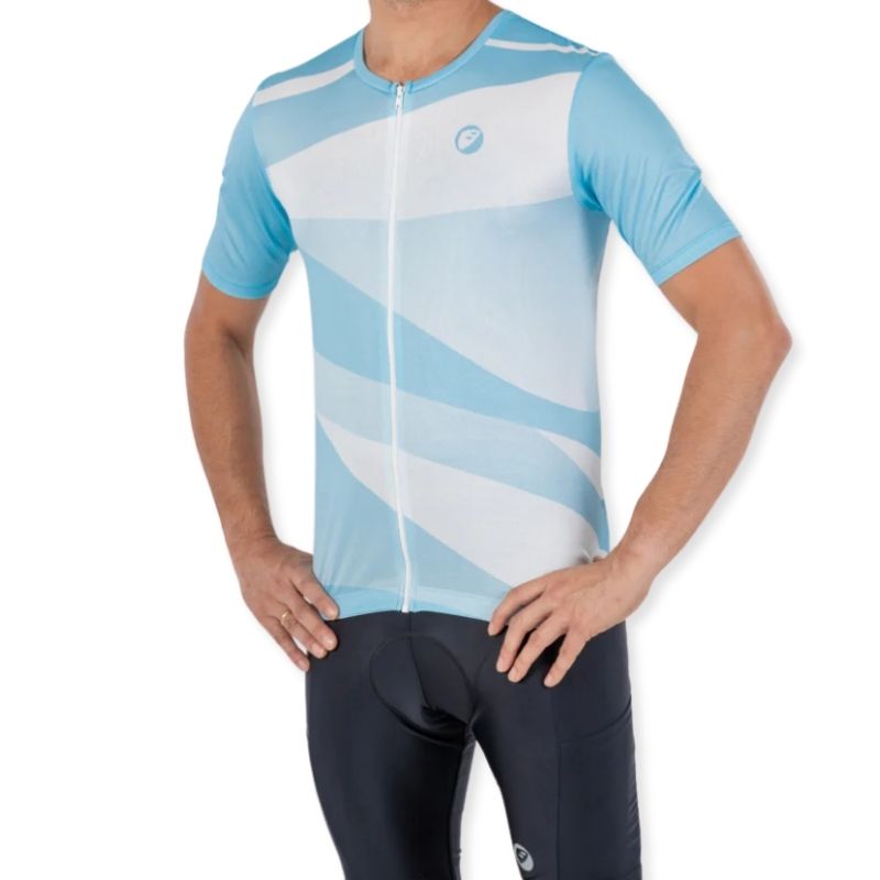 Apace women's relaxed fit cycling jersey in blue with short sleeves and breathable fabric, displayed on a hanger.