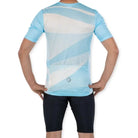 Apace women's relaxed fit cycling jersey in blue with short sleeves, featuring a comfortable, breathable fabric for active riding.