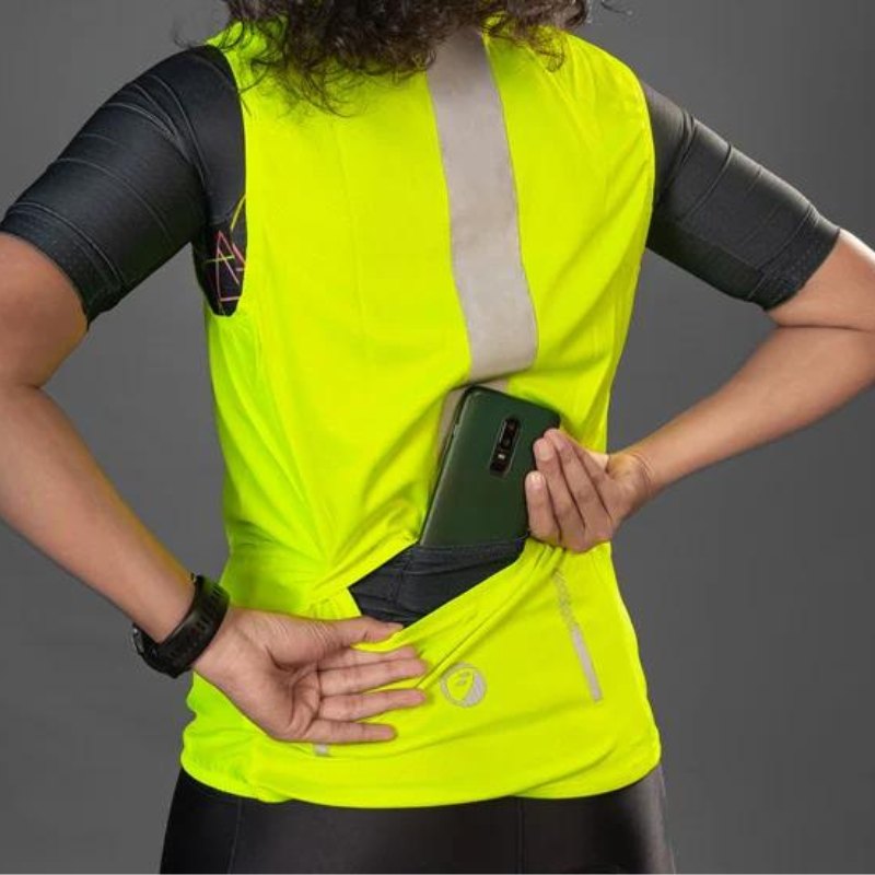 Apace women's sleeveless sports vest jacket in neon color, lightweight and designed for active wear, shown on a hanger.