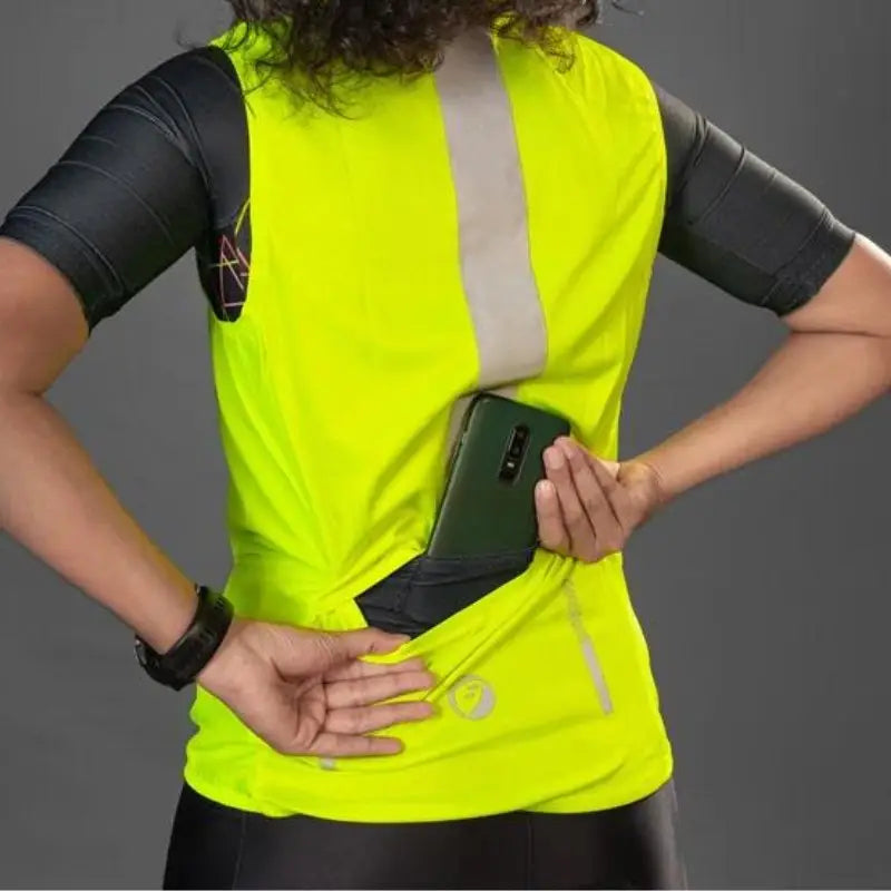 Apace women's sleeveless sports vest jacket in neon color, lightweight and designed for active wear, shown on a hanger.