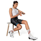 Apace Women's Verge Nuovo triathlon shorts in black with red accents, designed for athletic performance and comfort.