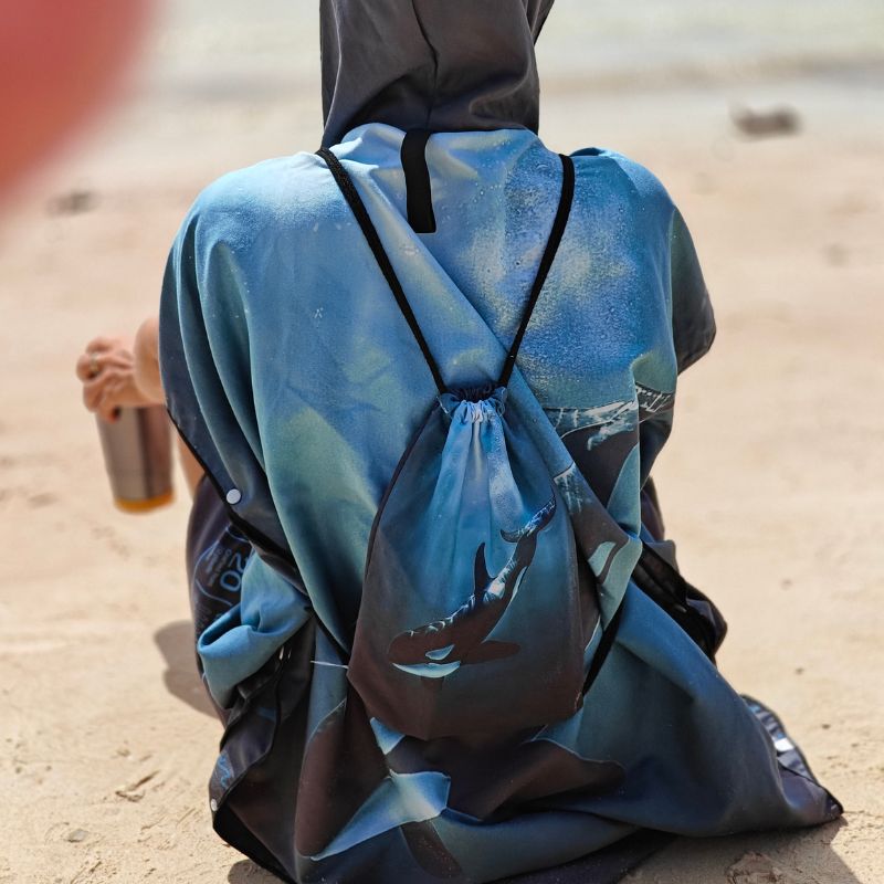 Azen unisex lightweight microfiber hooded beach towel with a colorful pattern, designed for quick drying and comfort at the beach.