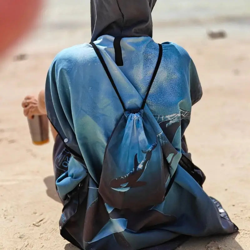 Azen unisex lightweight microfiber hooded beach towel with a colorful pattern, designed for quick drying and comfort at the beach.