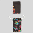 Black Azen unisex microfiber beach towel laid flat, showcasing its soft, lightweight fabric and versatile design for beach and outdoor use.