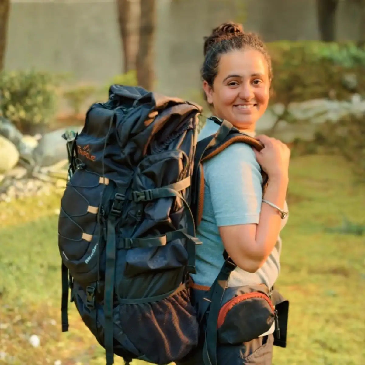 Black and brown hiking backpack with reinforced straps and a durable fabric finish