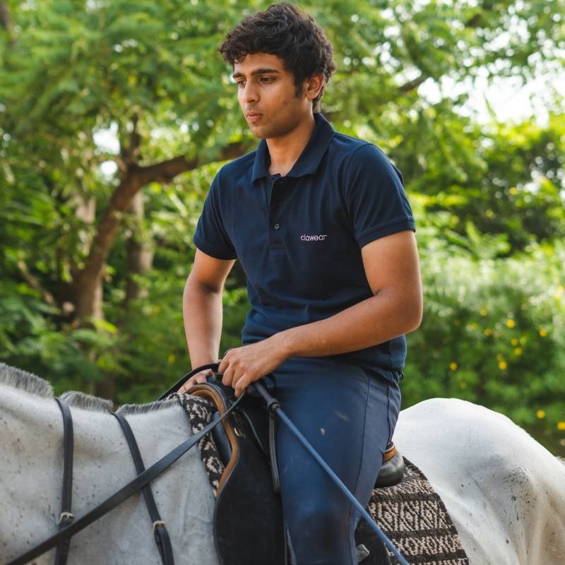 Clawear men's Bandhavgarh polo T-shirt in blue, featuring a classic collar and short sleeves, displayed flat on a white background.