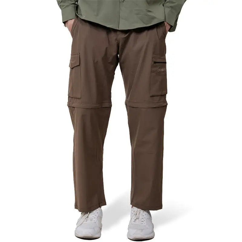Clawear men's Kuno convertible cargo pants in brown, showing adjustable waistband and multiple cargo pockets.