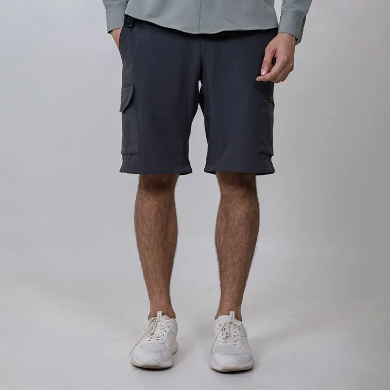 Clawear men's Kuno convertible cargo pants in dark grey, featuring multiple pockets and adjustable design for versatile wear.