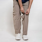 Clawear men's Kuno convertible cargo pants in black, showing multiple pockets, adjustable waistband, and versatile design.