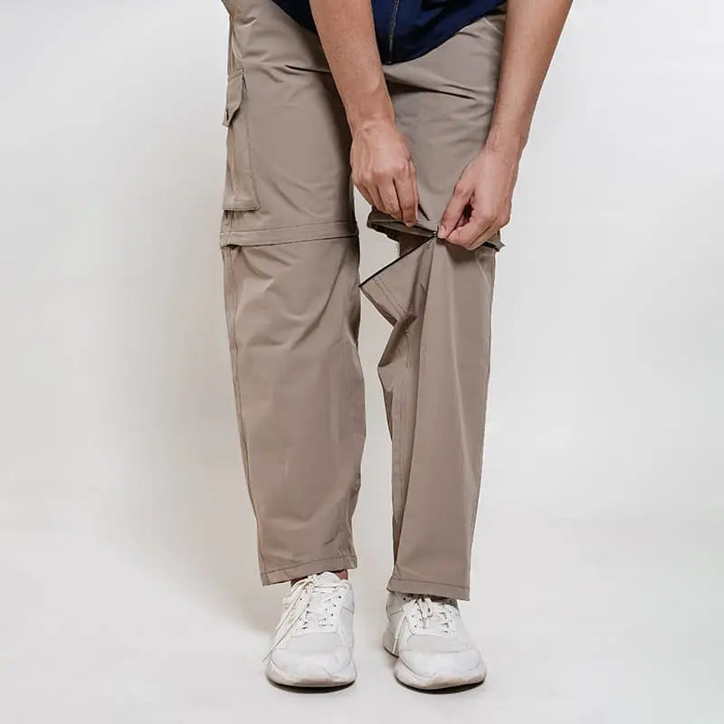 Clawear men's Kuno convertible cargo pants in black, showing multiple pockets, adjustable waistband, and versatile design.