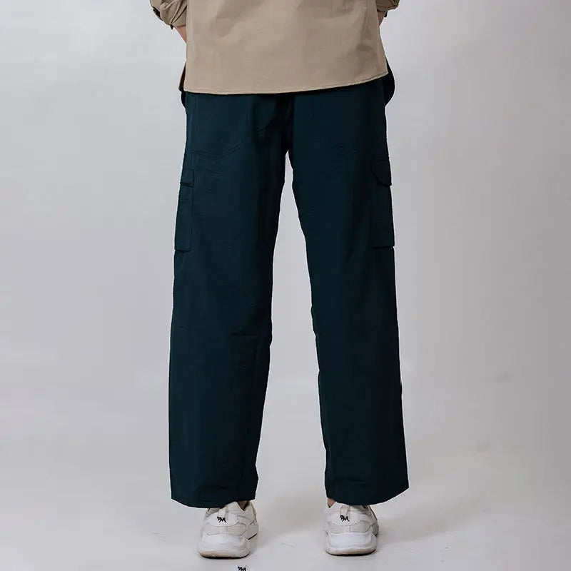 Green Clawear Men's Masai Cargo Pants with multiple pockets and relaxed fit, styled for casual wear.
