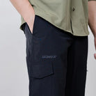Clawear Men's Masai Cargo Pants in black, featuring multiple pockets and a relaxed fit, made from durable fabric.