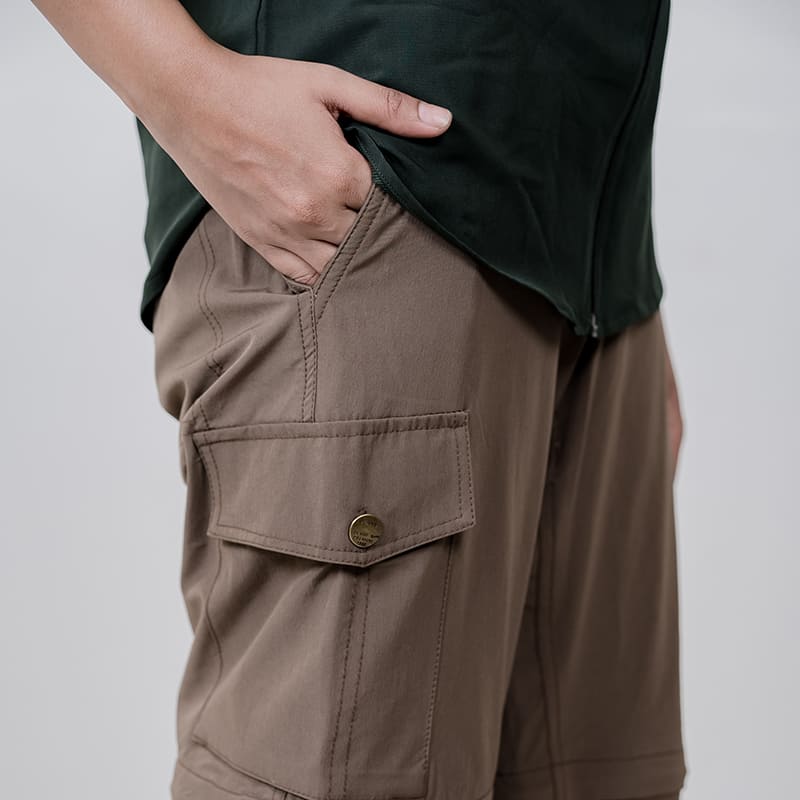 Clawear Women's Kuno convertible cargo pants in brown, featuring multiple pockets and adjustable hems for versatile wear.