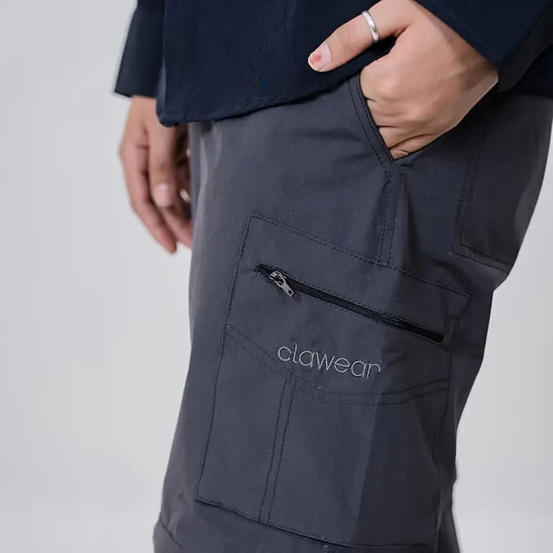 Clawear Women's Kuno Convertible Cargo Pants in gray, featuring multiple pockets and adjustable design for versatile wear.