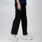 Black Clawear Women's Kuno convertible cargo pants with multiple pockets and adjustable features, shown on a model.