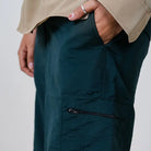 Clawear Women's Masai cargo pants in green with multiple pockets, relaxed fit, and functional design for casual wear.