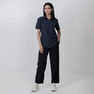 Black Clawear Women's Masai Cargo Pants with multiple pockets and relaxed fit, styled for casual wear.