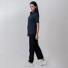 Black Clawear Women's Masai Cargo Pants with multiple pockets and relaxed fit, styled for casual wear.
