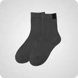 Dark gray ribbed knit ankle socks with a small black rectangular tag on the heel.