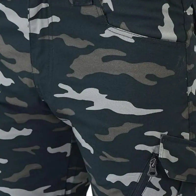Indian Sports Gear men's Cobra Combat tactical cargo pant in green, featuring multiple pockets and durable fabric for outdoor activities.