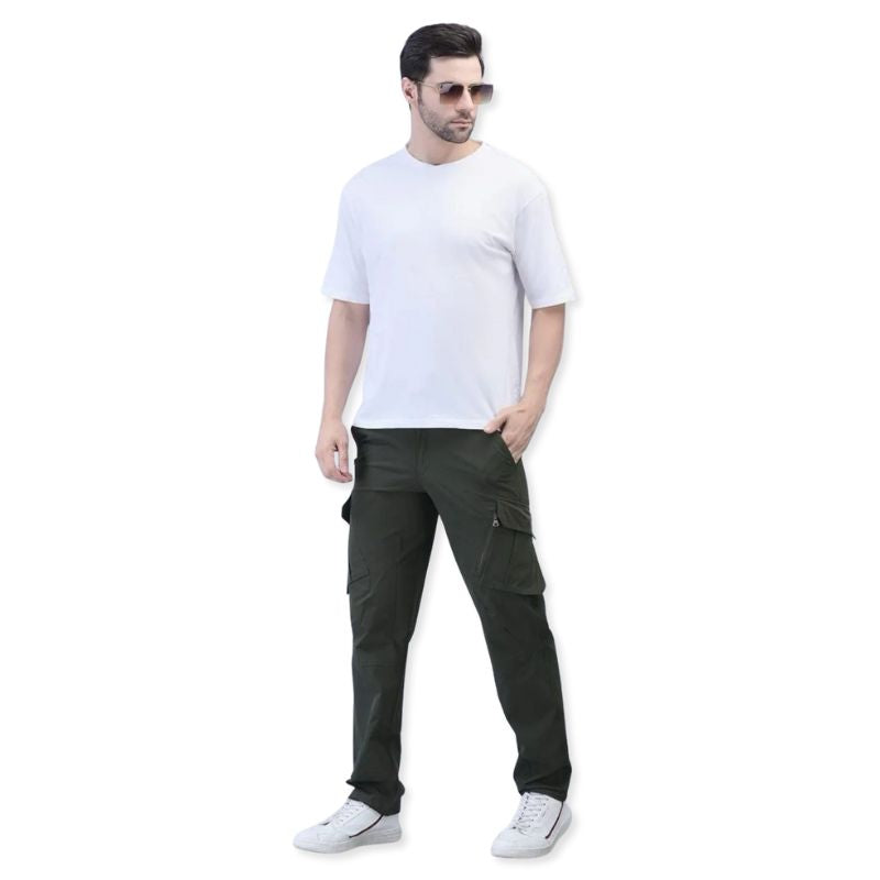 Green men's stretchable nylon lycra cargo pants by Indian Sports Gear, featuring multiple pockets and a comfortable fit.