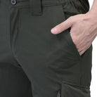 Green men's nylon lycra stretchable cargo pants by Indian Sports Gear, featuring a relaxed fit and multiple utility pockets.